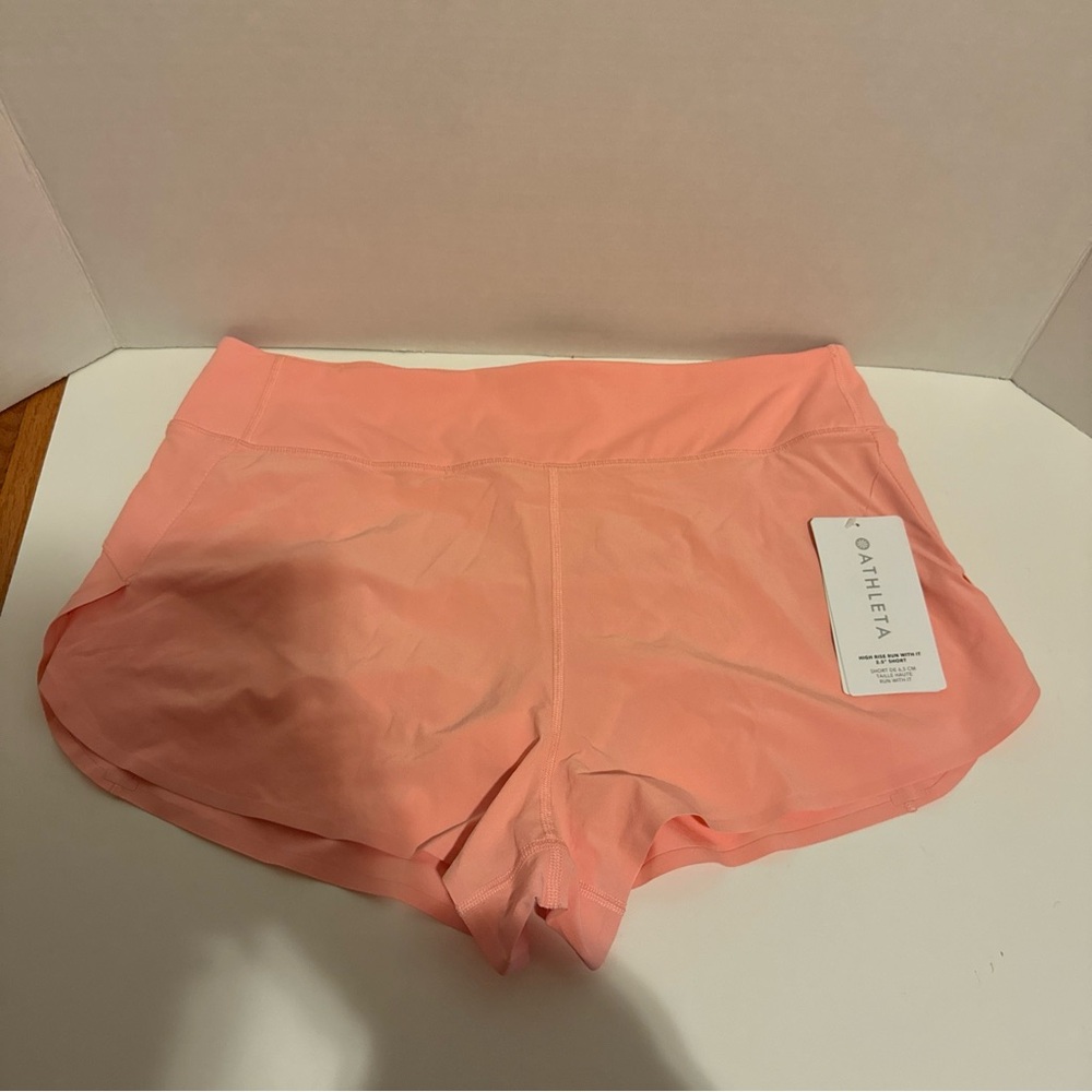Athleta high rise run with it 2.5” pink shorts Large NWT
